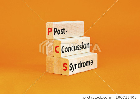 PCS post-concussion syndrome symbol. Concept words PCS post-concussion syndrome on wooden blocks on beautiful orange table orange background. Medical PCS post-concussion syndrome concept. Copy space. 100719403