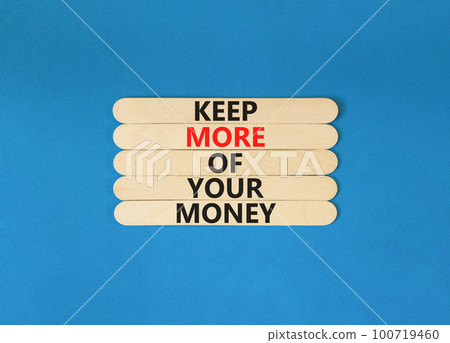 Keep more of your money symbol. Concept words Keep more of your money on wooden stick. Beautiful blue table blue background. Business keep more of your money concept. Copy space. 100719460