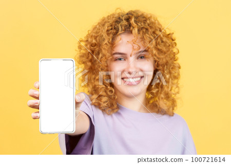 Blank screen of the mobile held by a young woman Blank screen of the mobile held by a young woman 100721614