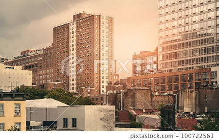 New York cityscape at sunset, color toning applied, USA. New York cityscape at sunset, color toning applied, USA. 100722561