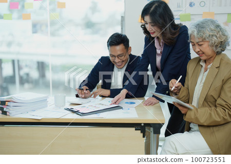 Asian entrepreneurs and business people meeting in a conference room in business planning, financial budget and investment risk assessment to analyze customer groups to increase company growth. Asian entrepreneurs and business people meeting in a conference room in business planning, financial budget and investment risk assessment to analyze customer groups to increase company growth. 100723551