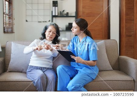 Portrait of a female doctor holding a patient clipboard to discuss and analyze wrist and finger pain Portrait of a female doctor holding a patient clipboard to discuss and analyze wrist and finger pain 100723590