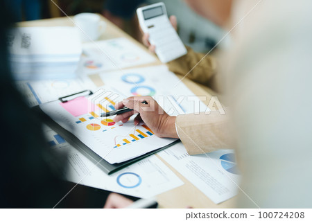 Asian entrepreneurs and business people meeting in a conference room in business planning, financial budget and investment risk assessment to analyze customer groups to increase company growth. Asian entrepreneurs and business people meeting in a conference room in business planning, financial budget and investment risk assessment to analyze customer groups to increase company growth. 100724208