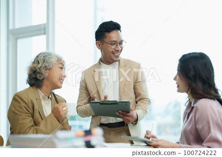 Asian entrepreneurs and business people meeting in a conference room in business planning, financial budget and investment risk assessment to analyze customer groups to increase company growth. Asian entrepreneurs and business people meeting in a conference room in business planning, financial budget and investment risk assessment to analyze customer groups to increase company growth. 100724222