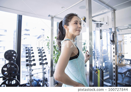 Young woman training in the gym Young woman training in the gym 100727844