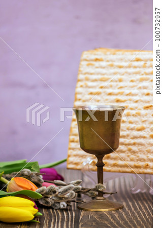 Passover festival is Jewish holiday in which unleavened bread matzah cup of kosher kiddush wine Passover festival is Jewish holiday in which unleavened bread matzah cup of kosher kiddush wine 100732957