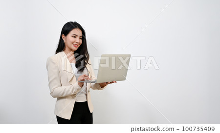 Beautiful millennial Asian businesswoman using her laptop. isolated white background. 100735409