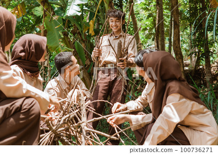 a boy scout gets dry twigs for a fireplace a boy scout gets dry twigs for a fireplace 100736271