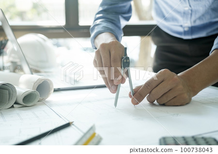 Engineer, architect working using compass. Engineer, architect working using compass. 100738043