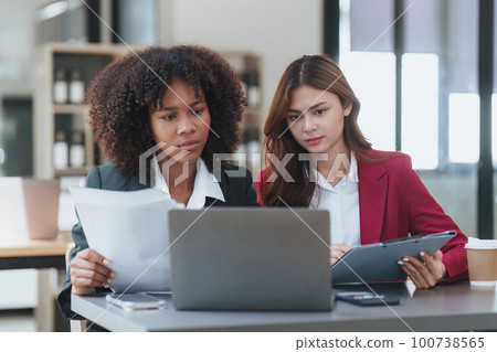 Multiethnic business people in meeting. Accountant people do document, tax, exchange, accounting and Financial advisor concept Multiethnic business people in meeting. Accountant people do document, tax, exchange, accounting and Financial advisor concept 100738565