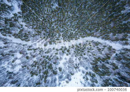 Flight over the winter mountains with road serpentine and pine forest. Top down view. Landscape photography Flight over the winter mountains with road serpentine and pine forest. Top down view. Landscape photography 100740036