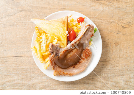 pork chop steak with chips and mini salad 100740809