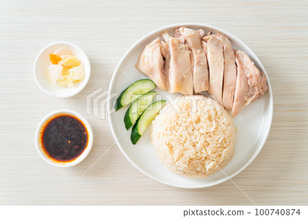 Hainanese chicken rice or rice steamed with chicken soup Hainanese chicken rice or rice steamed with chicken soup 100740874