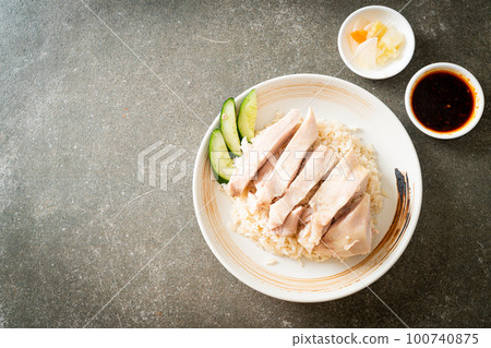 Hainanese chicken rice or rice steamed with chicken soup Hainanese chicken rice or rice steamed with chicken soup 100740875
