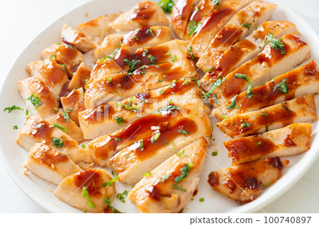 grilled chicken breast sliced on plate 100740897
