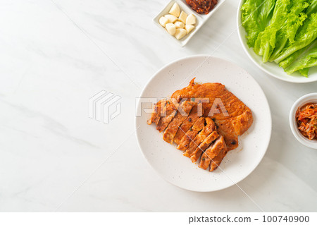 grilled pork marinated Kochujang sauce in Korean style with vegetable and kimchi grilled pork marinated Kochujang sauce in Korean style with vegetable and kimchi 100740900