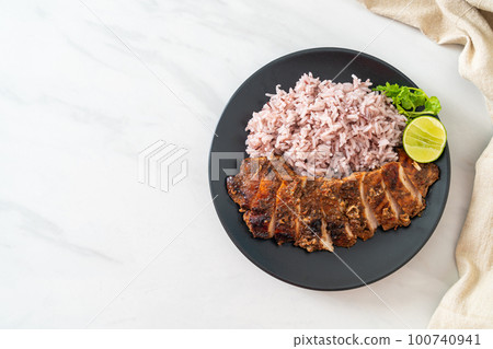 spicy grilled Jamaican jerk chicken with rice spicy grilled Jamaican jerk chicken with rice 100740941