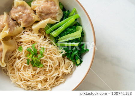 dried egg noodles with pork wonton or pork dumplings without soup dried egg noodles with pork wonton or pork dumplings without soup 100741198