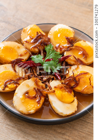 Fried Boiled Egg with Tamarind Sauce 100741279