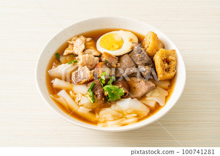 paste of rice flour or boiled Chinese pasta square in clear soup 100741281