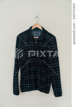 black jacket hanging with wood hanger black jacket hanging with wood hanger 100741929
