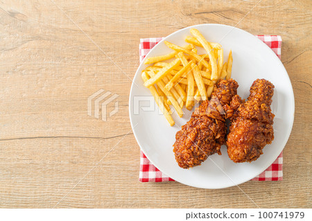 spicy Korean fried chicken with fries spicy Korean fried chicken with fries 100741979