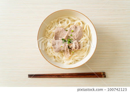 udon noodles with pork in clear soup udon noodles with pork in clear soup 100742123