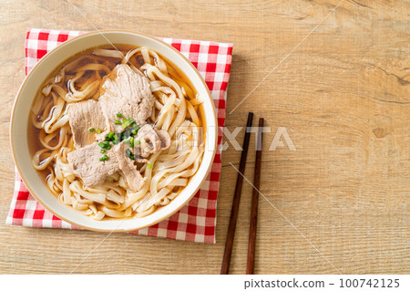 homemade udon noodles with pork in soy or shoyu soup homemade udon noodles with pork in soy or shoyu soup 100742125