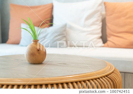 ceramic or porcelain vase with plant decoration on table in living room ceramic or porcelain vase with plant decoration on table in living room 100742451