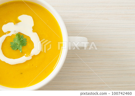 pumpkin soup in white bowl pumpkin soup in white bowl 100742460
