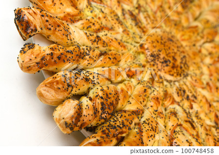 Sun recipe in puff pastry with smoked salmon and boursin cheese 100748458