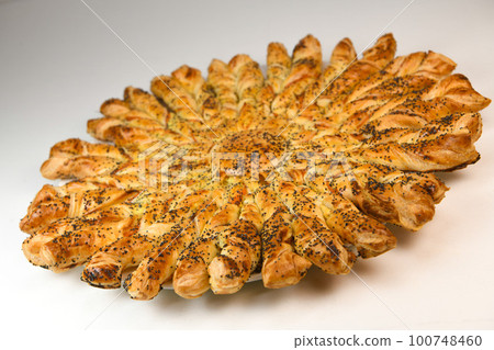 Sun recipe in puff pastry with smoked salmon and boursin cheese 100748460