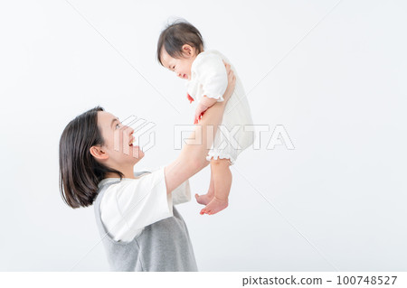 A mother soothing her baby A mother soothing her baby 100748527