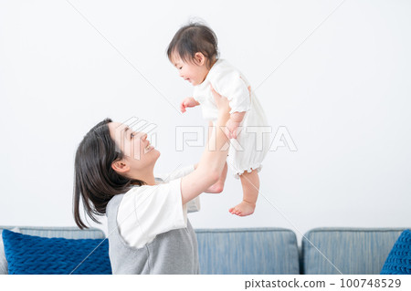 A mother soothing her baby 100748529