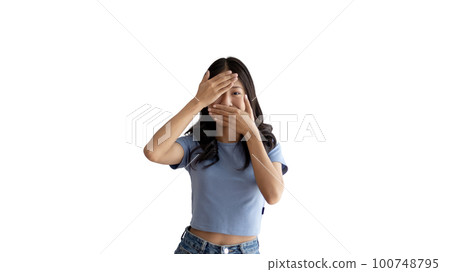Young woman covering her face and eyes with her hands isolated, Cover your eyes with your hands for fear or prying eyes, Sneak peek, White background. Young woman covering her face and eyes with her hands isolated, Cover your eyes with your hands for fear or prying eyes, Sneak peek, White background. 100748795