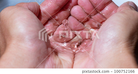 water droplets splashing in hand water droplets splashing in hand 100752166