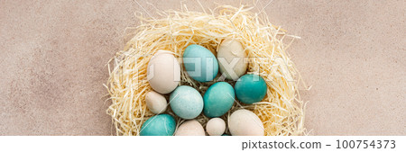 Easter eggs in a nest 100754373