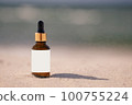 Skincare with beauty cosmetic face serum. Glass brown bottle with a pipette on a natural background with san 100755224