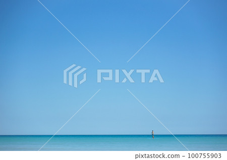 Landscape of a man floating on the sea with SUP Landscape of a man floating on the sea with SUP 100755903
