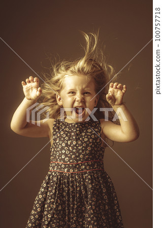 little girl with funny expression 100757718