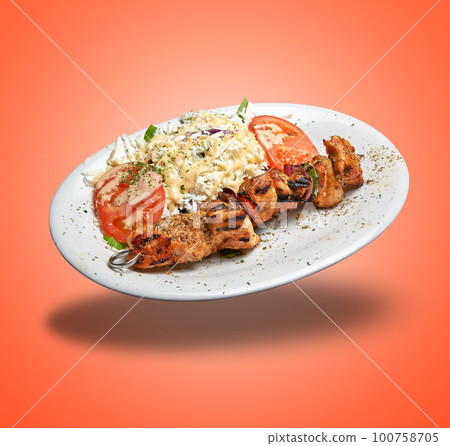Floating White plate with Chicken skewer and salad 100758705