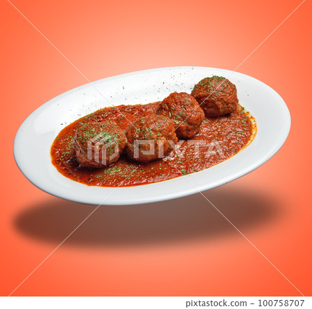 Floating White plate with Beef meats balls and tomato sausage 100758707