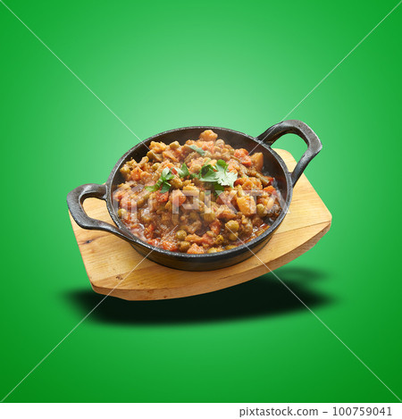Floating Vegetable baked in little pan on green 100759041