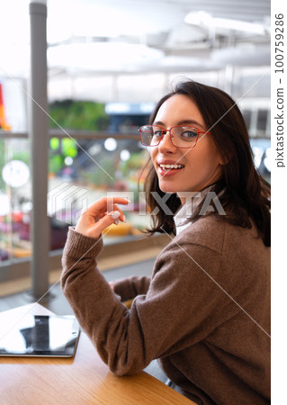 Woman in glasses with tablet computer Woman in glasses with tablet computer 100759286