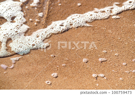Flat lay surface of sandy beach with yellow sand and small stones background. Flat lay surface of sandy beach with yellow sand and small stones background. 100759473