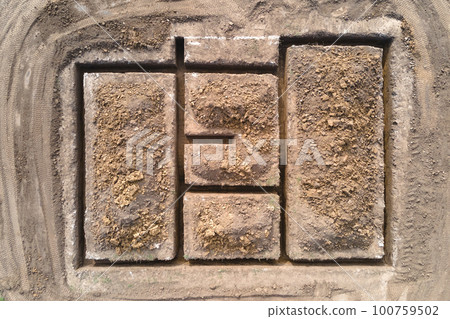 Dug out trench for building works of new house concrete foundation on construction site Dug out trench for building works of new house concrete foundation on construction site 100759502