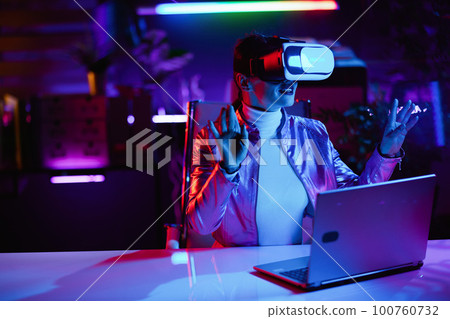 happy woman designing virtual reality in office happy woman designing virtual reality in office 100760732