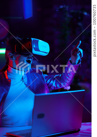cheerful stylish woman in vr headset in modern office 100760735