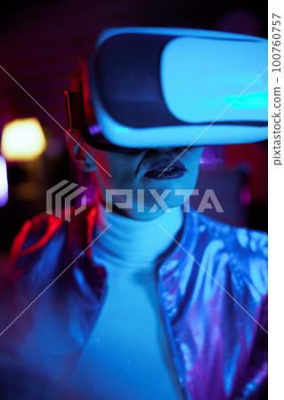 stylish woman in vr headset on dark background stylish woman in vr headset on dark background 100760757