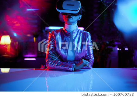 modern woman in vr headset in modern office 100760758